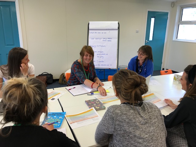 Vicky Gordon working with primary school teachers around a table